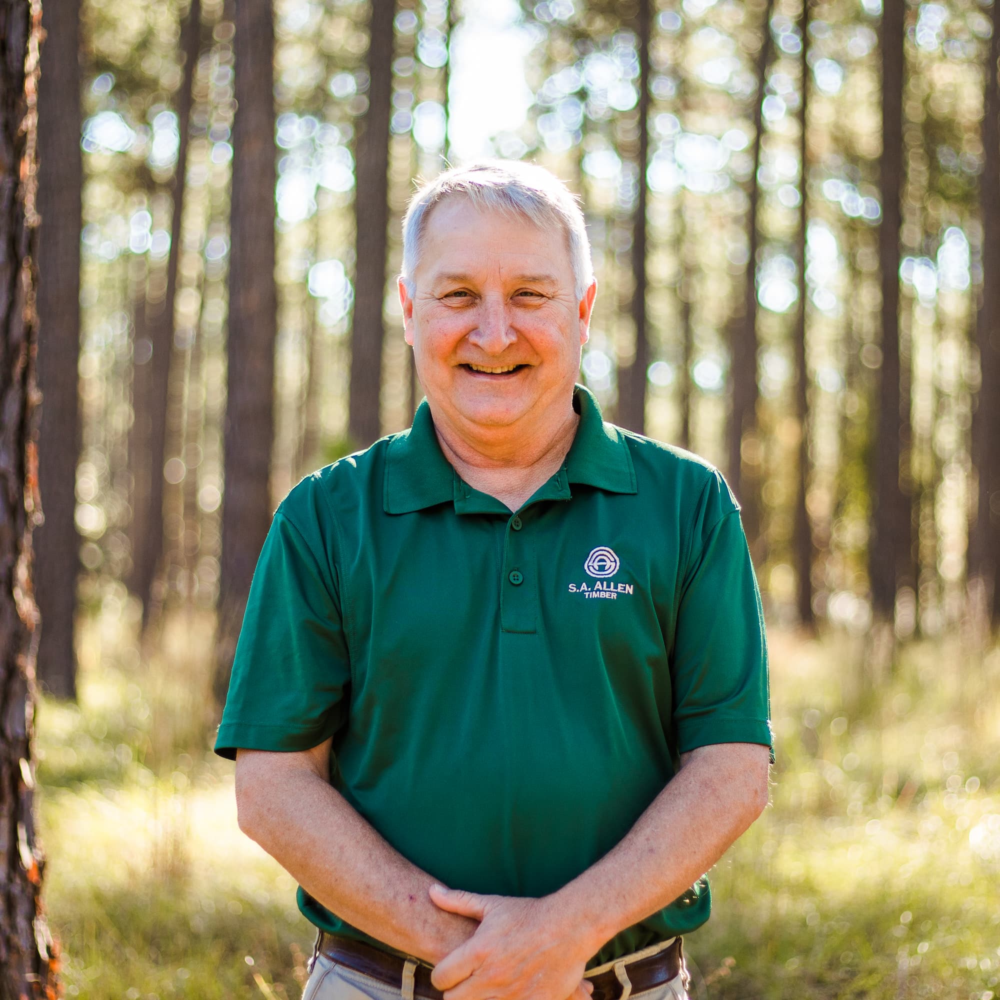 man infront of wood